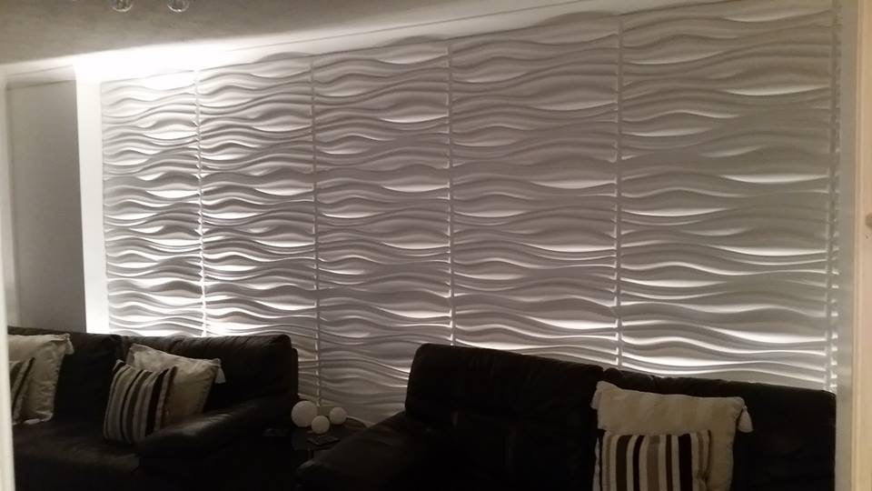 Monroe 3D PVC wall panels installed on a living room wall, showcasing the texture and design