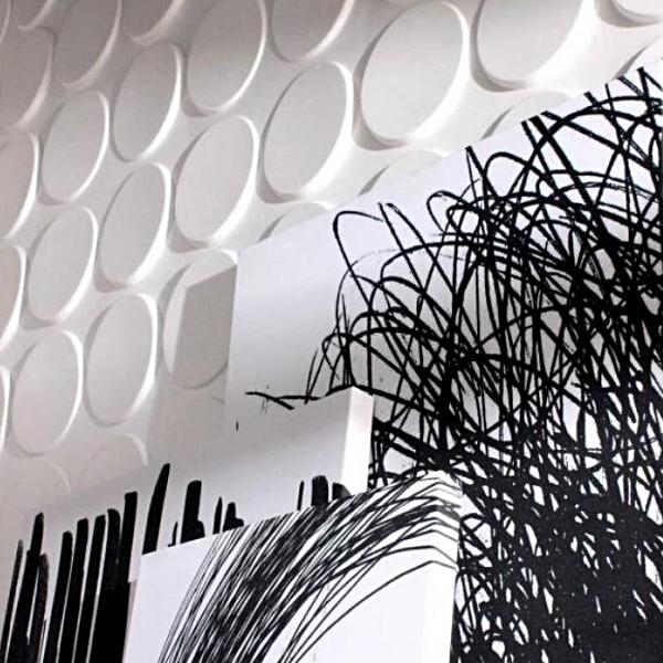 Decorative Cirque 3D PVC wall panels with a black and white pattern installed on a wall
