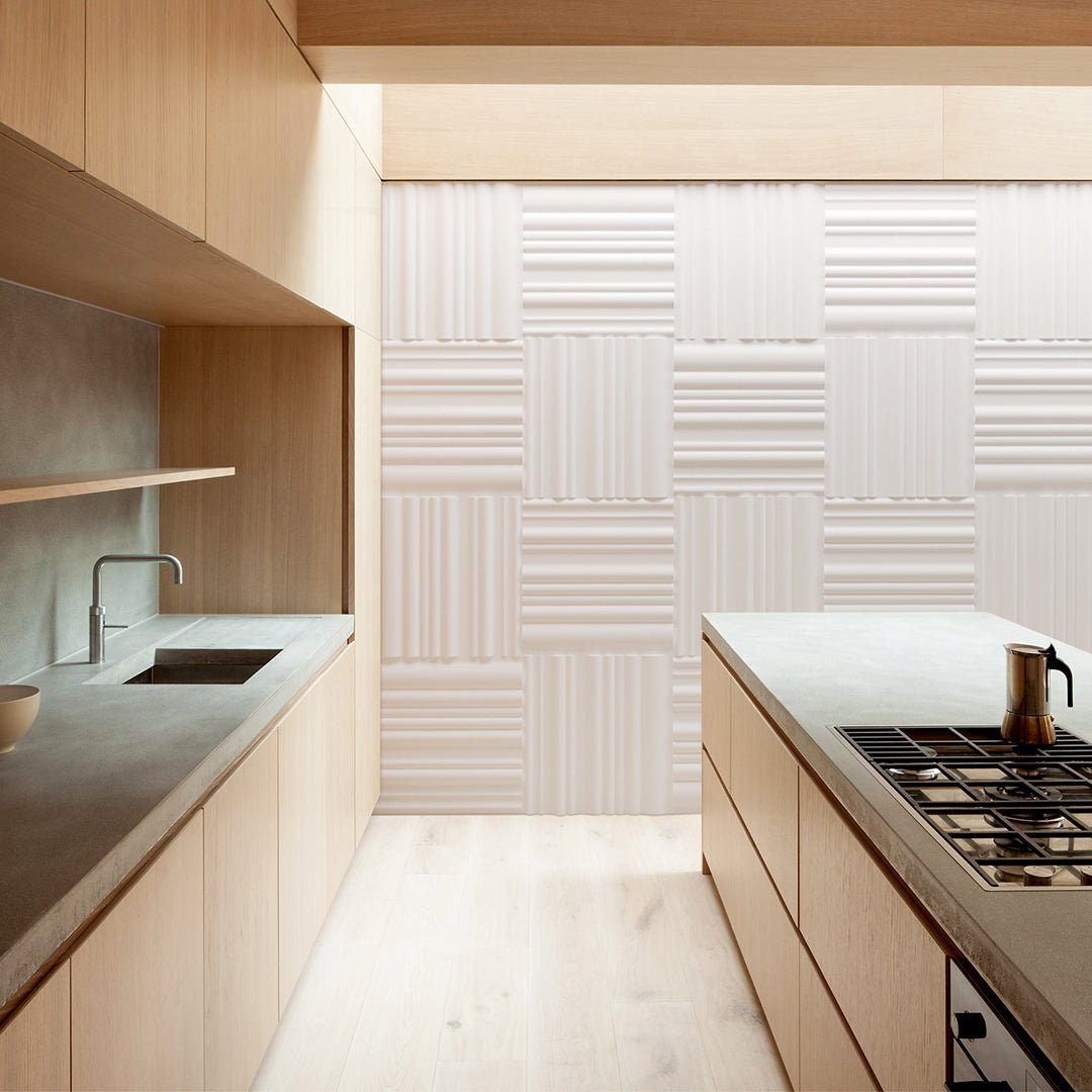 3D plaster wall panels with a bands design installed in a modern kitchen