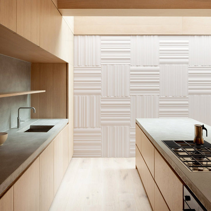 3D plaster wall panels with a bands design installed in a modern kitchen