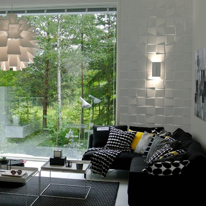 Modern living room featuring Citadel 3D Plaster Wall Panels as a decorative element with a comfy sofa and scatter cushions