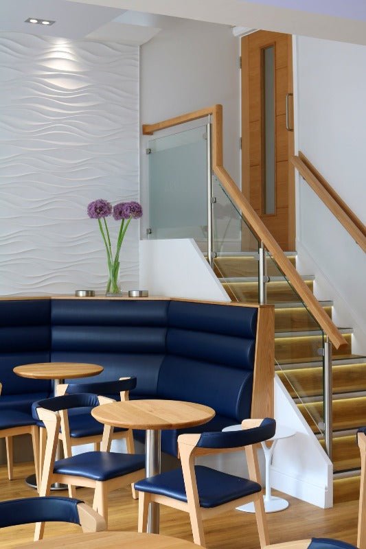 Contemporary restaurant interior featuring Jet Stream 3D MDF Wall Panels and blue chairs