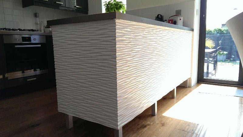 Kitchen showcasing a white 3D ocean wave MDF panel as a backsplash with wooden accents