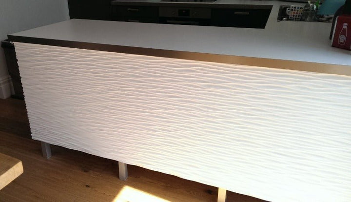 Contemporary kitchen featuring an MDF wall panel with a 3D ocean wave pattern