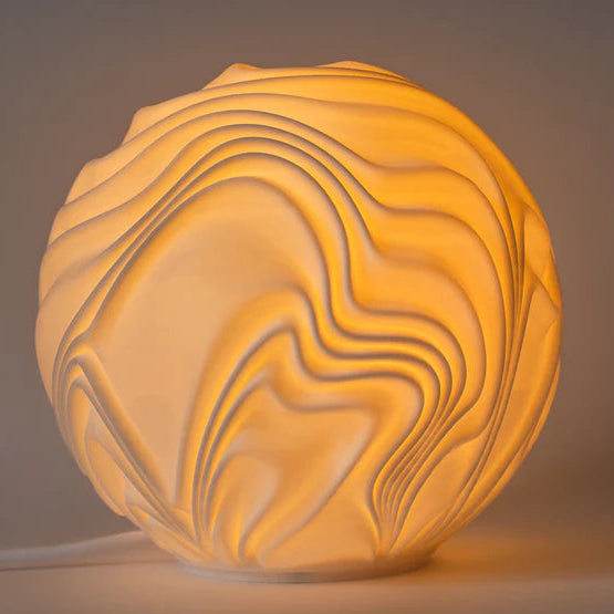 Decorative spherical lamp with wavy patterns on a plain background