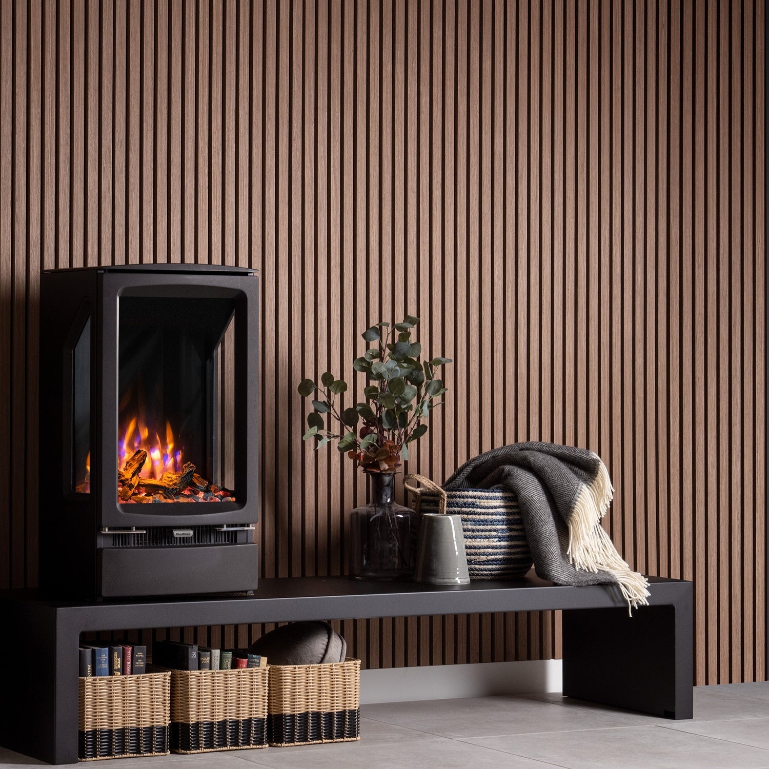 Wooden slat wall panels in a living room setting with log burner