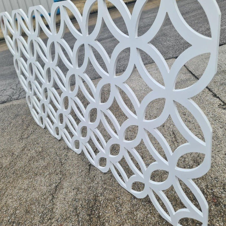 side angle view of the cut out circular/flower design fretwork panel in landscape position