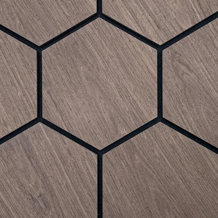 Hexagonal Dark Walnut Acoustic Tiles seamlessly installed on a wall