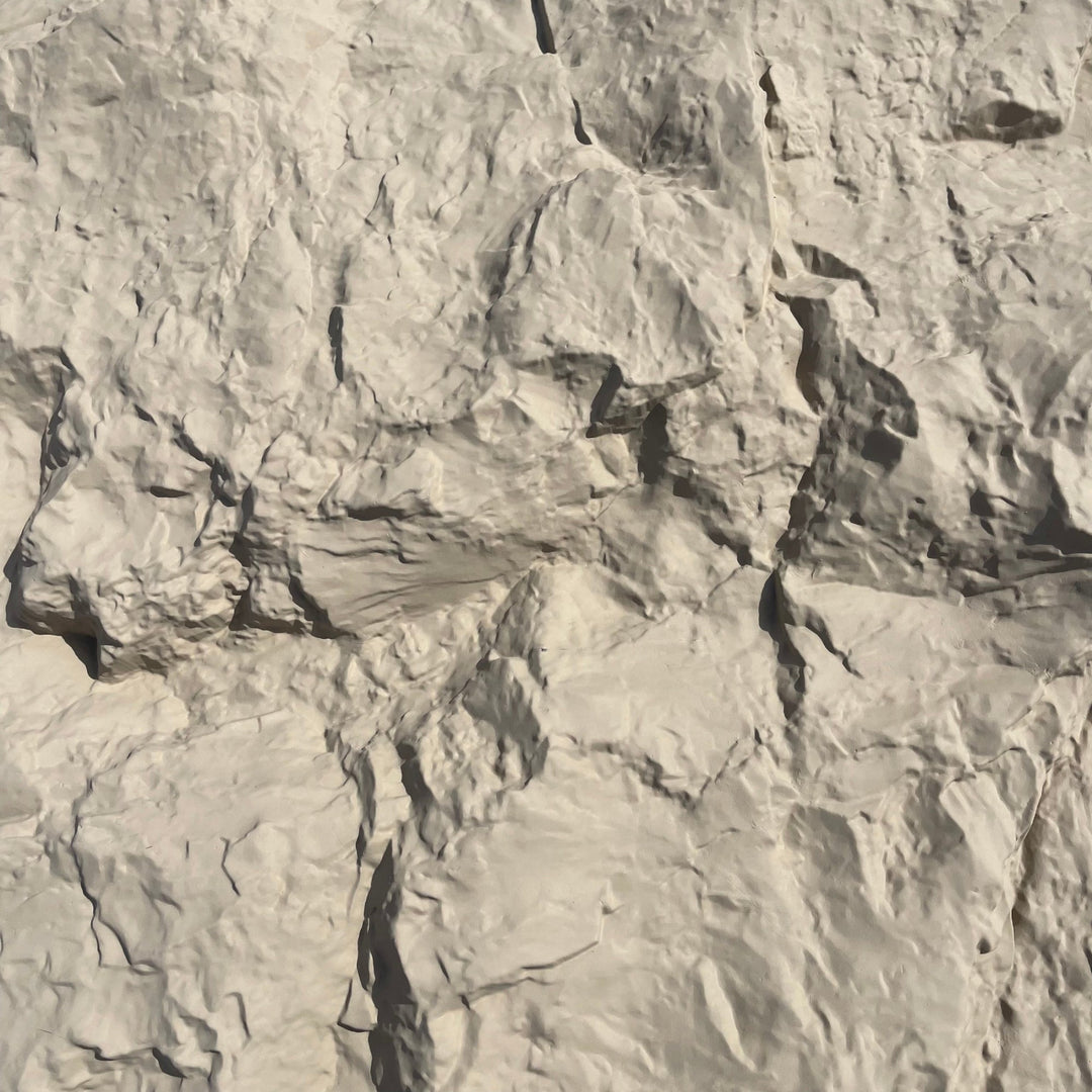 Close-up of pale grey natural rock texture with deep cracks and fissures - PU wall panel