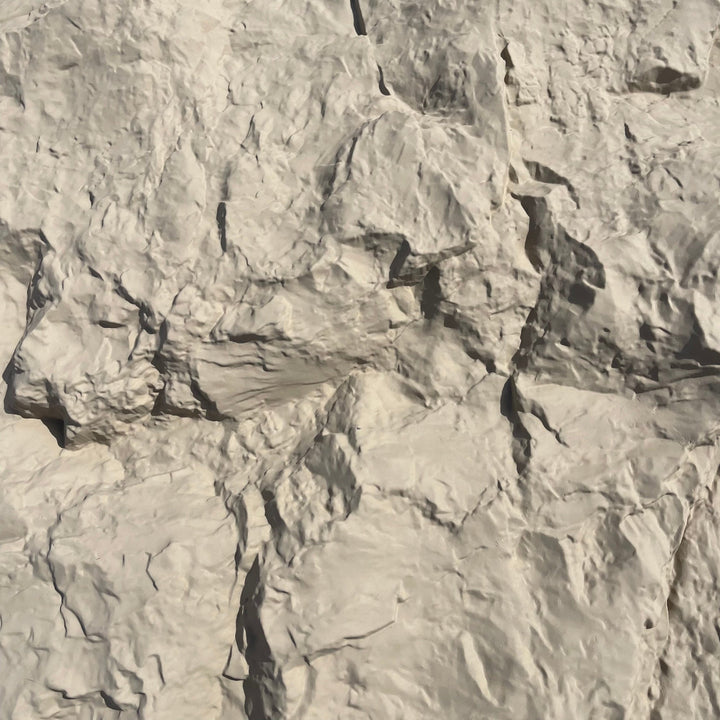 Close-up of pale grey natural rock texture with deep cracks and fissures - PU wall panel