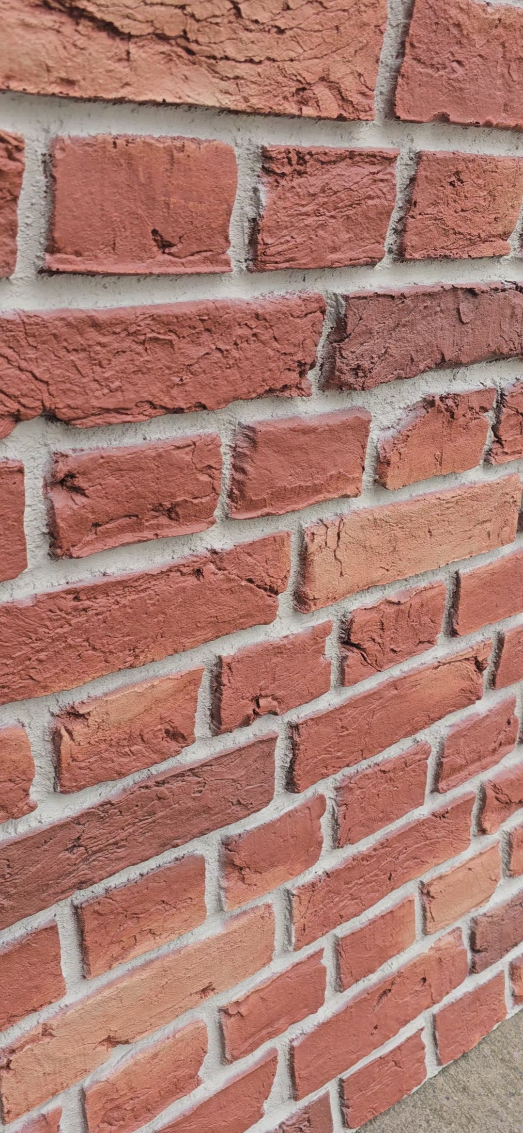 Close-up of fiberglass brick effect wall panel surface texture 